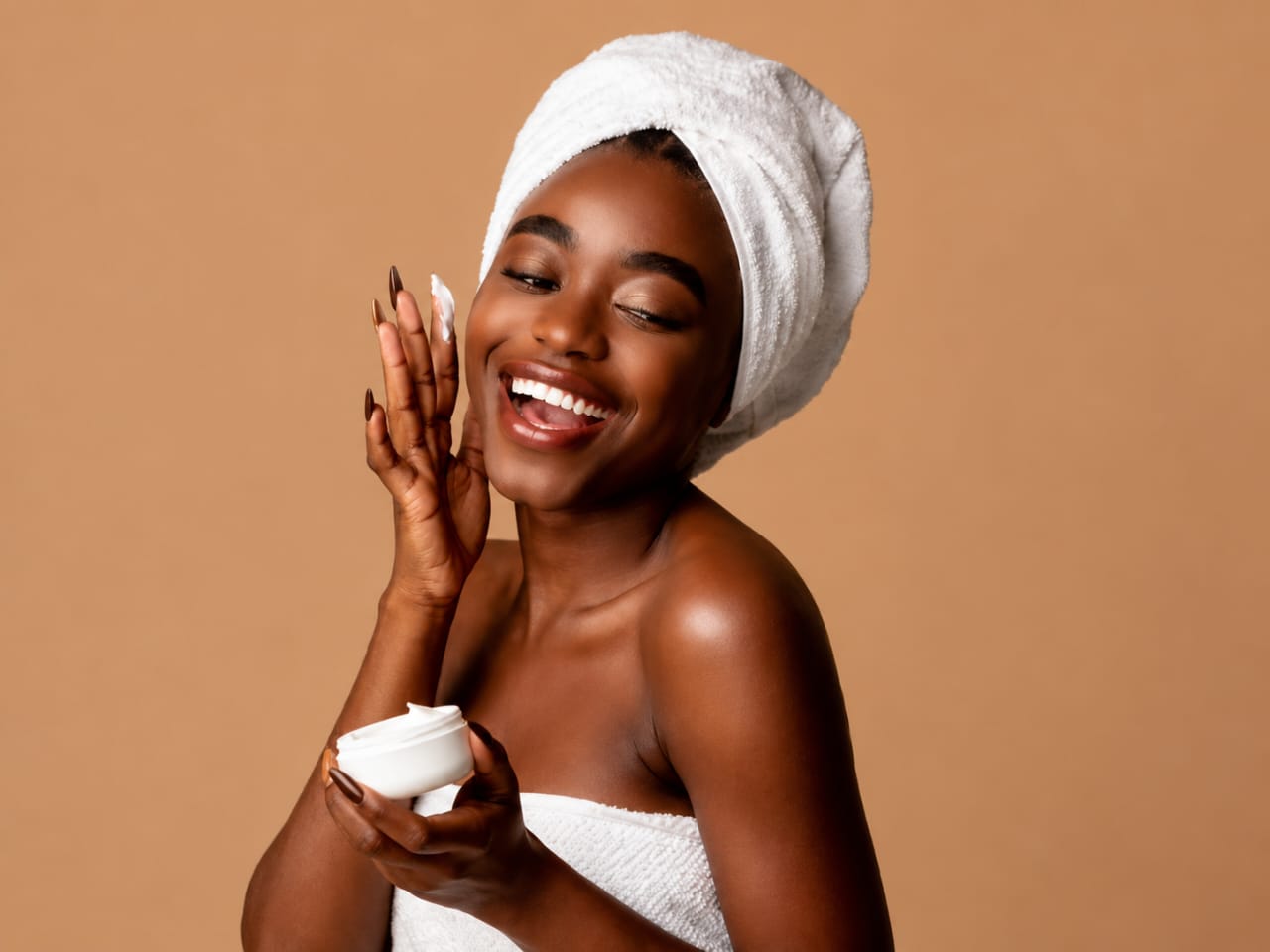 Woman enjoying her QOI skincare ritual